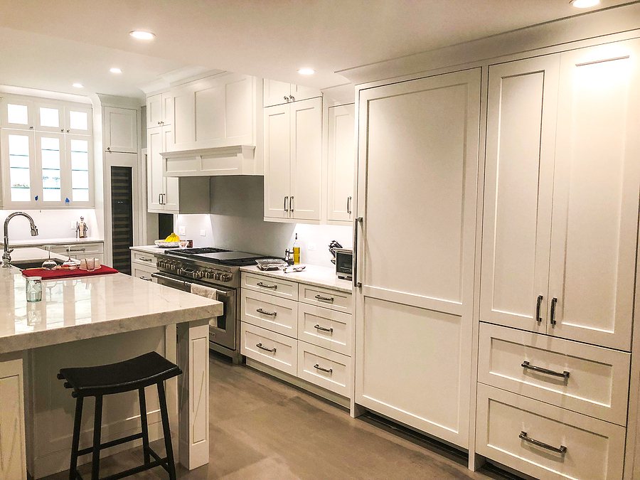 Built in white cabinets in a luxury kitchen remodel. 