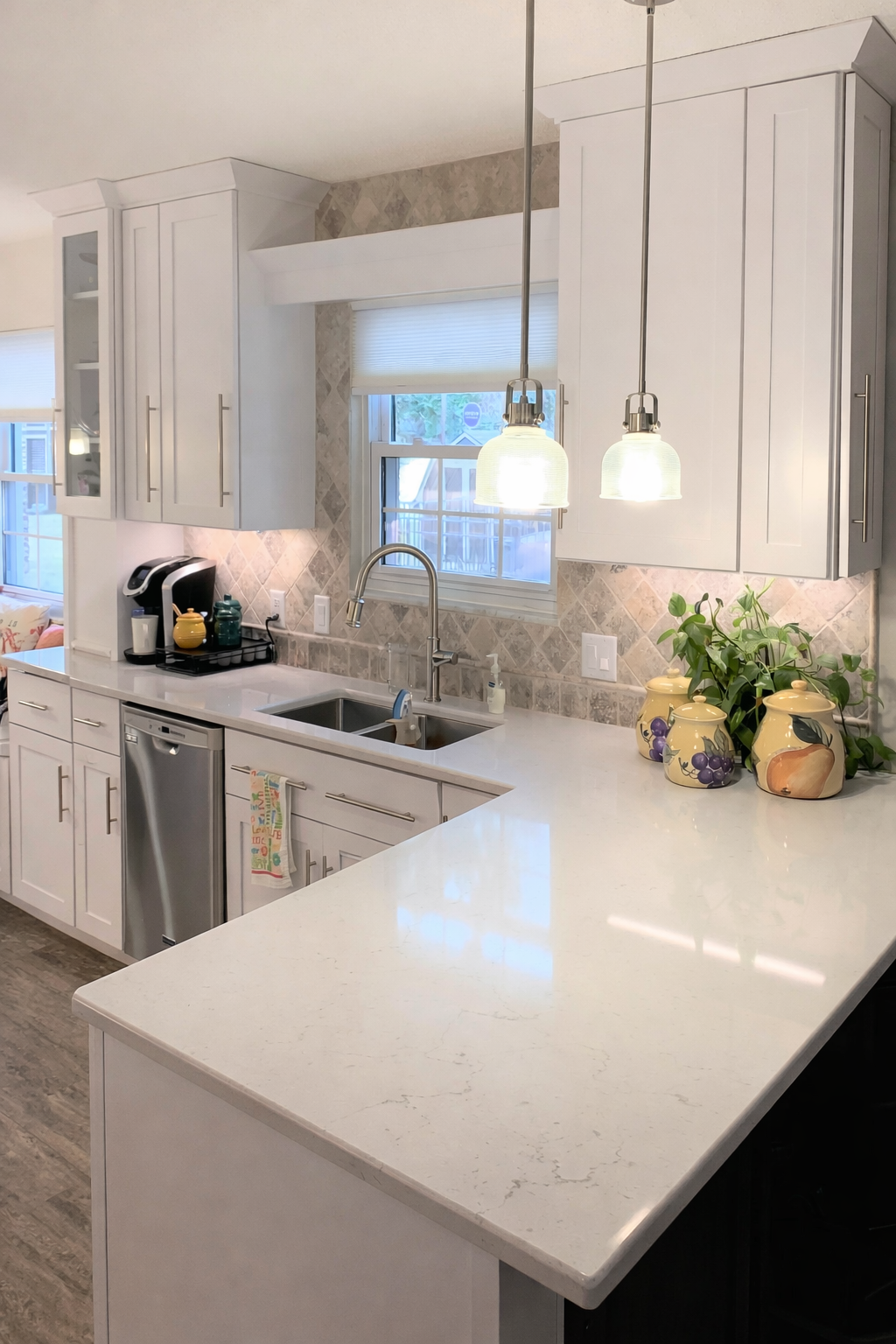 Updated kitchen with modern cabinets, countertops and lighting. 